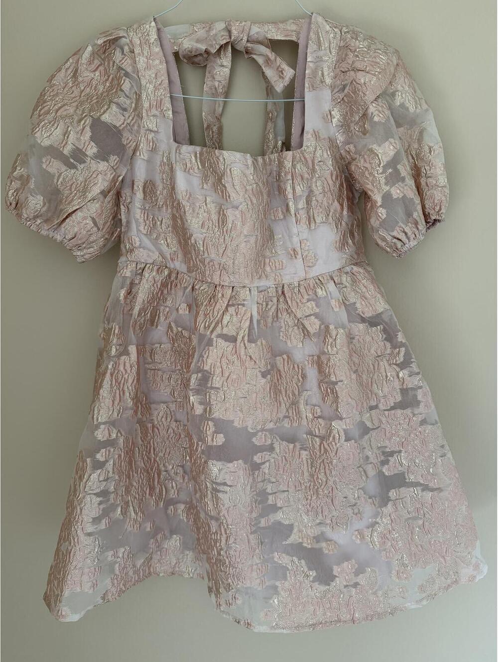 Lena M short pink formal dress, lined, puff sleeves, zips & ties at back